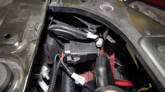 Attach the relay AND Ground Strap end of the Water Pump/EVAP Harness through the