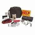 This kit contains a 12 foot booster cable, Flashlight, 3 AAA Batteries, Cotton Gloves, Duct Tape, a poncho, Pliers, a Screwdriver, a shop cloth, a bungee cord, Assorted Fuses, a HELP sign, Bandaids,