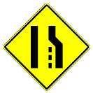 There is only room for one lane of traffic. B. The right lane ends, merge left. C. You are coming to a gravel road. D.