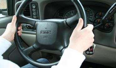 STEERING Put both hands on the steering wheel with the knuckles of the hands on the outside of the steering wheel.