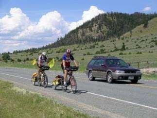 When passing a bicycle or motorcycle, move into another lane as you would when passing a slower car or farm vehicle.