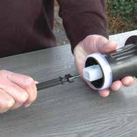 Unscrew and remove the bell housing (you may use a universal strap wrench), pulling the