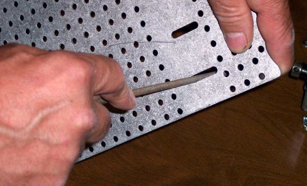 To alleviate this problem increase the length of the slots by filing them with a 3/16 diameter round or rat tail file similar to those used to sharpen a chain saw (see the illustration below).