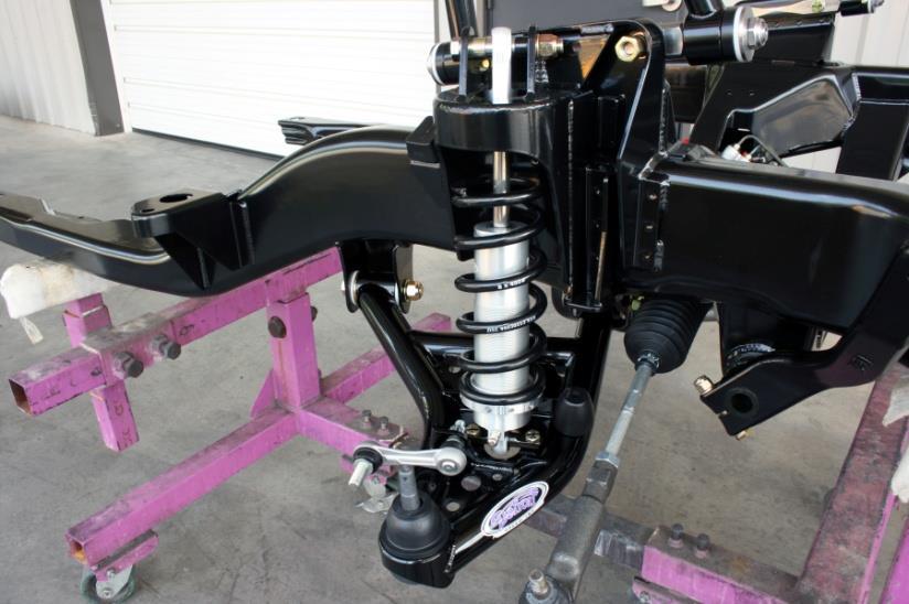 Install the rack and pinion assembly from below the crossmember for better clearance and easier alignment.