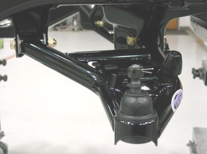Pilot holes for the Bolt on Z-bar Bracket are located in the frame rails. The appropriate holes in the front frame must be drilled larger to be tapped. These holes are shown in Figure 2.