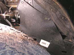 Remove two bolts and brake line brackets from driver and