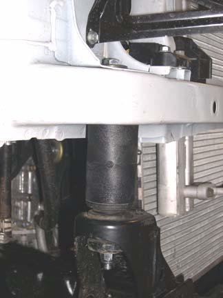 Installing the kit blocks without the factory upper and lower bushings could result in damage to the vehicle and/or serious personal injury.