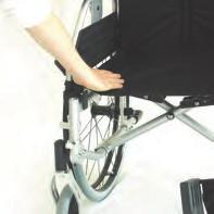 Now press with the flat of the hand against the seat tube nearest you to unfold the wheelchair (Fig. 4).