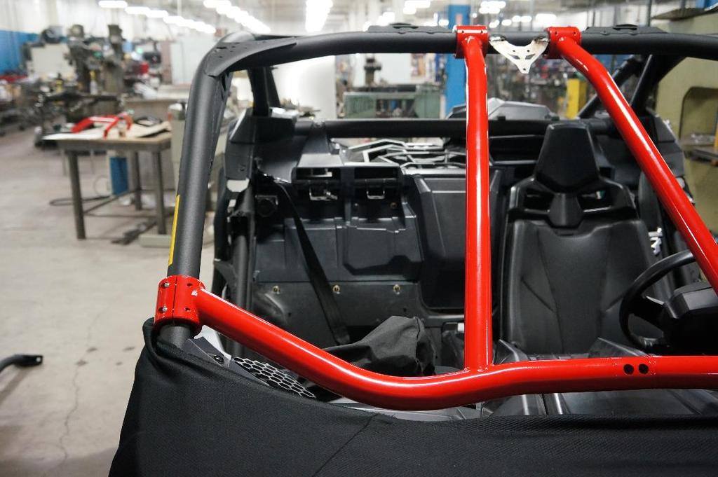 4. Slide the passenger side intrusion bar in place and hand tighten the lower and upper roll cage clamps like the driver side bar.(fig. 4-1) Figure 4-1 5. Install the two M8x1.