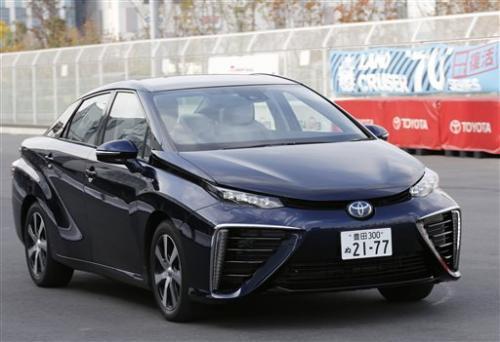 Motor Corp.'s new fuel cell vehicle Mirai drives at its showroom test course in Tokyo.