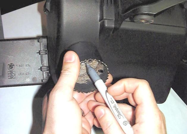 Remove the lower half of the air box from the car by removing the two 10mm head bolts as shown in