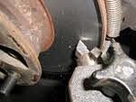 Brake rotor resurfacing - front Operation Description: Removing the wheels is the first step in resurfacing the rotors.