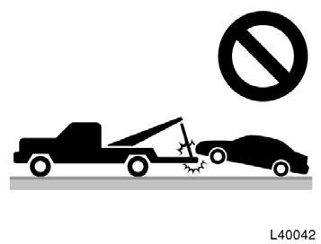 (c) Towing with sling type truck (c) Towing with sling type truck NOTICE Do not tow with sling type truck, either from the front or rear. This may cause body damage.