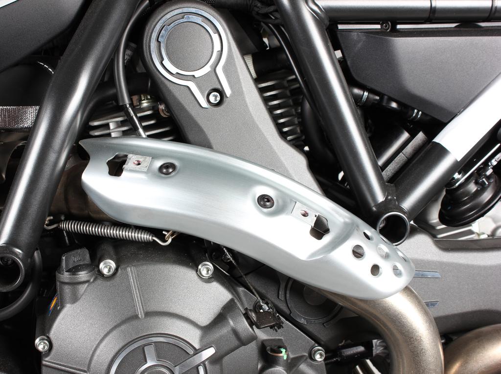 Unscrew the marked bolts and remove the outer heat shield (Figure 1). CAUTION: make sure not to damage any part of the motorcycle during this process!