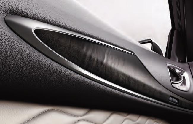 Notice the detail in every stitch, the unique contrast on the leather-wrapped steering wheel and grab handles. Even the seat belts are lighter in color to complement the interior design theme.