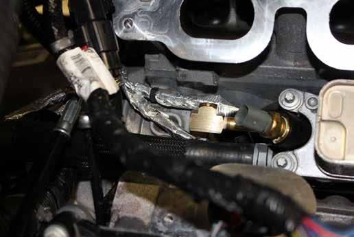 Disconnect 2 electrical connectors and remove oil pressure