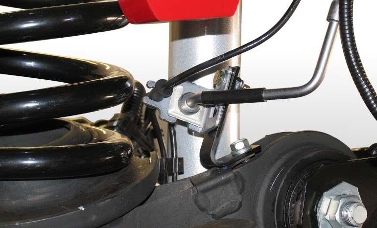 NOTE: Use loctite and take care not to strip out self-tapping screws used on brake line mounts.