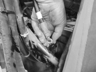 Note: Verify that the hoses have been properly marked prior to removing them to ensure they are reattached to the correct ports. 9.
