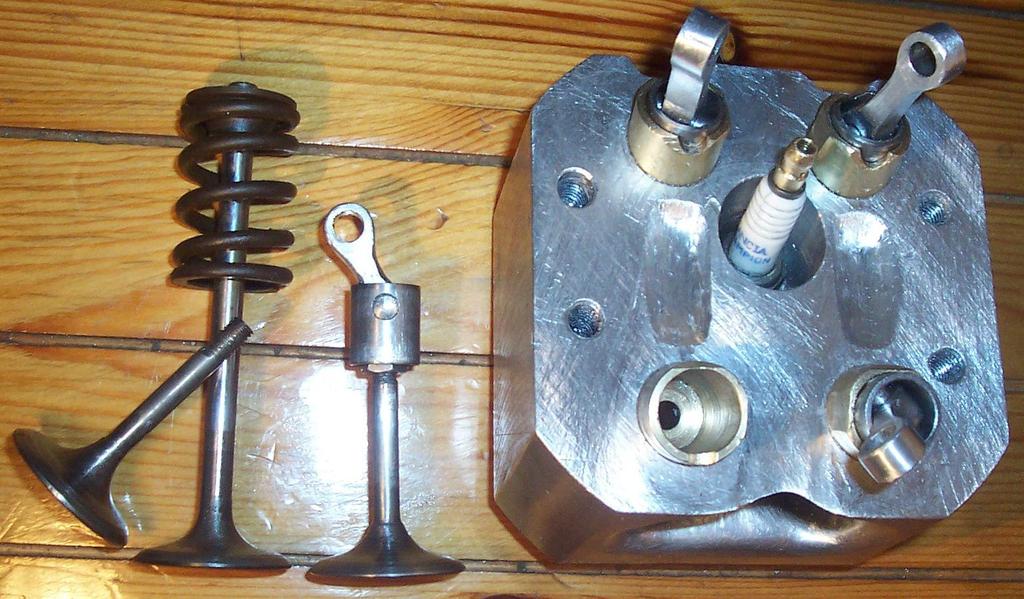 The conventional intake valve with its valve spring