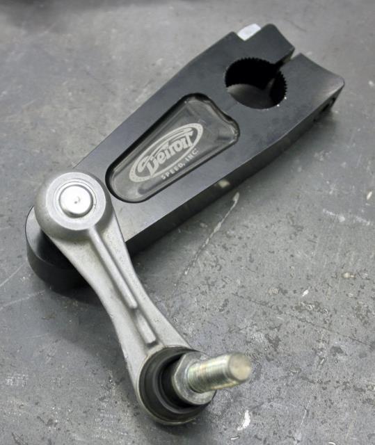NOTE: Be sure that the groove in the clamp is installed so that it points to the center of the vehicle and that the two clamps match on either side (Figure 18).