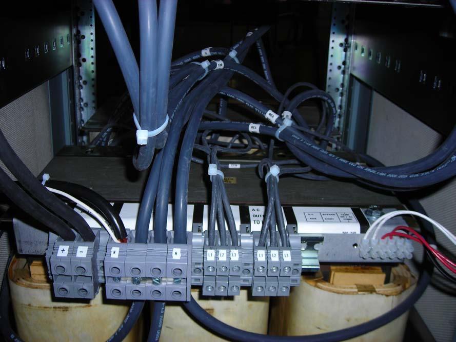 3) UPS Wiring I/O Terminal Block, located at rear of UPS The power terminal block (DIN) has 4 sections. DC, Neutral, Input, Output.