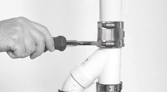 18. Ease the Y-assembly back into the no hub coupling on the discharge pipe and tighten the hose clamps. 19.