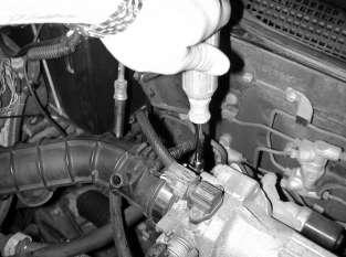 Remove the hose assembly from the car. d.