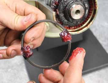 11. Coat the Cam Spacer and retainer plate with high pressure grease. 13. Install the hub snap ring into the hub.