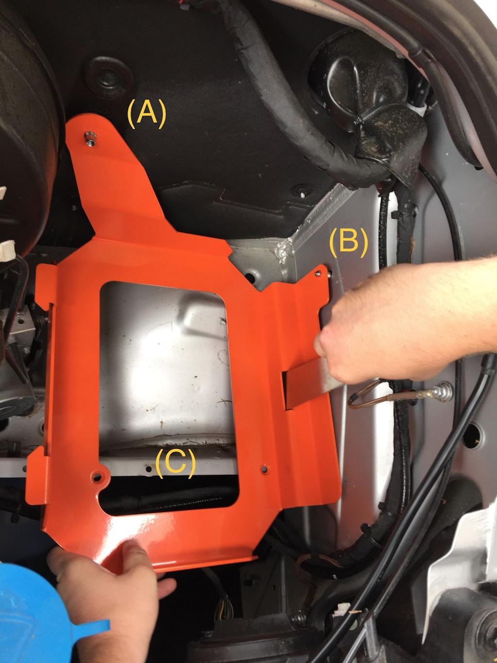 6. Place the tray tray into the driver side engine compartment.