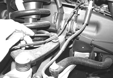 Retain parts and hardware for reinstallation. SEE PHOTOS IN NEXT COLUMN. 2. Disconnect the tie rod ends from the steering knuckle by striking the knuckle to dislodge the tie rod end.