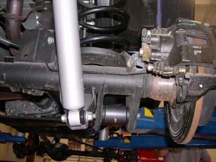 Install two kit boots (shock) onto two kit absorbers (shock, rear) with two kit ties (zip).