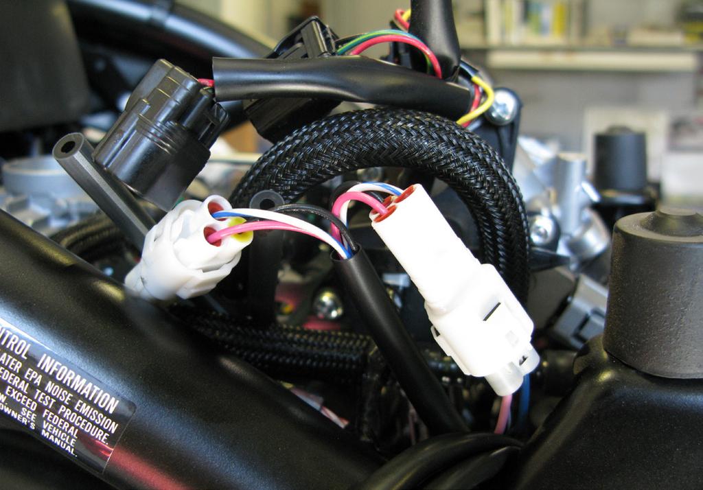 Connect the Bazzaz fuel harness to the control unit and begin routing the harness as shown in the below picture.
