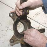 ring from the steering knuckle. 2. Using an appropriate press and 3.