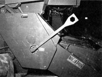 A rocking wrench was supplied for the rotor. Machine Cleaning: Cleaning the International Harvester 480 for combining seed grain was laborious and time-consuming.