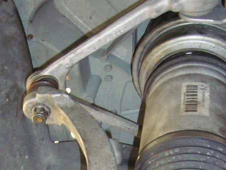 4. REMOVE THE UPPER A-ARM BALL JOINT NUT AND SEPARATE THE