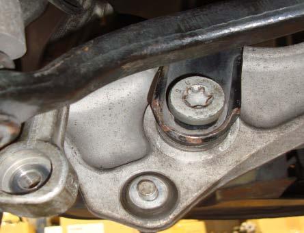 REMOVE THE LOWER SHOCK MOUNT NUT/BOLT.