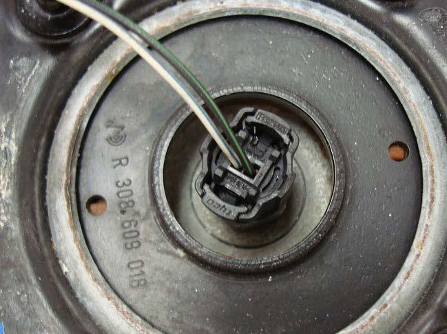 DISCONNECT THE ELECTRICAL CONNECTOR FROM THE TOP OF THE SHOCK