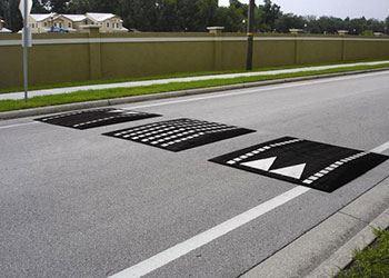 SPEED CUSHIONS Speed cushions are a modified speed hump that has openings to allow vehicles with wider wheelbases, such as a fire truck or an ambulance, unencumbered passage.