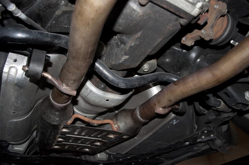 Removal of OEM exhaust system FIGURE 5 FIGURE 7 5.