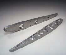 The 3/16" thick mount tabs have 3/8" diameter front and 5/16" diameter rear holes with 5-7/8" spacing. Tip plates are.