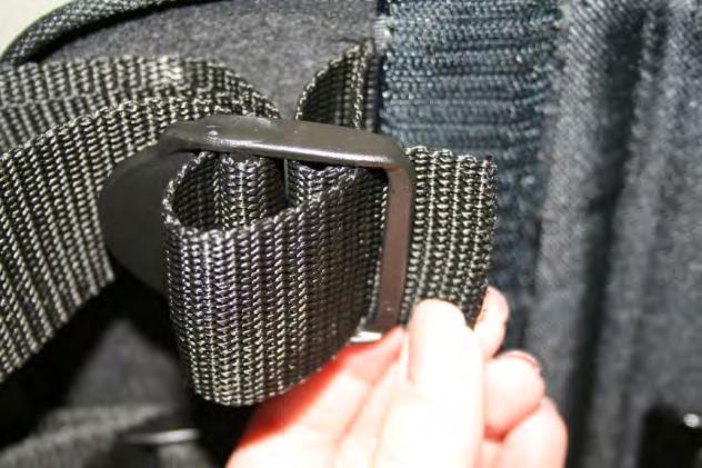 belt; returning the belt through the tensioning