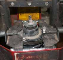 Remove the upper strut retaining nuts & remove the OEM struts from the bottom strut assemblies.