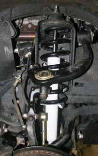 14. Connect the OEM outer tie rods to the OEM steering knuckles using the OEM hardware. 15.