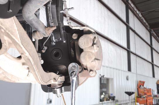 46. Install the brake caliper using the factory hardware.
