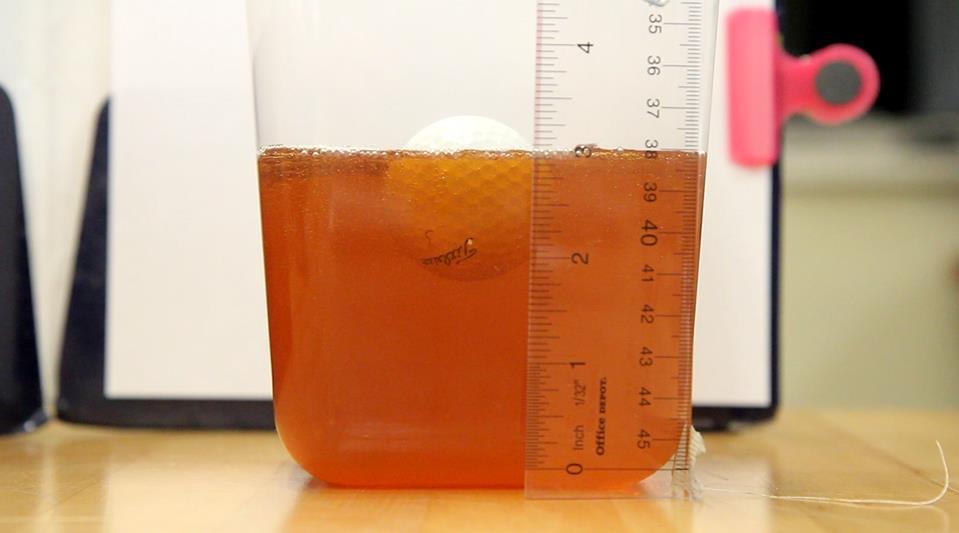 Figure 5.13. Golf Ball Floating in Agave The blackstrap molasses had the most positive results, offering a measurable resistance to the effects of the both forces.