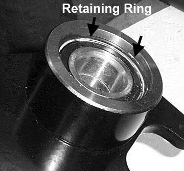 Remove the factory retaining ring that
