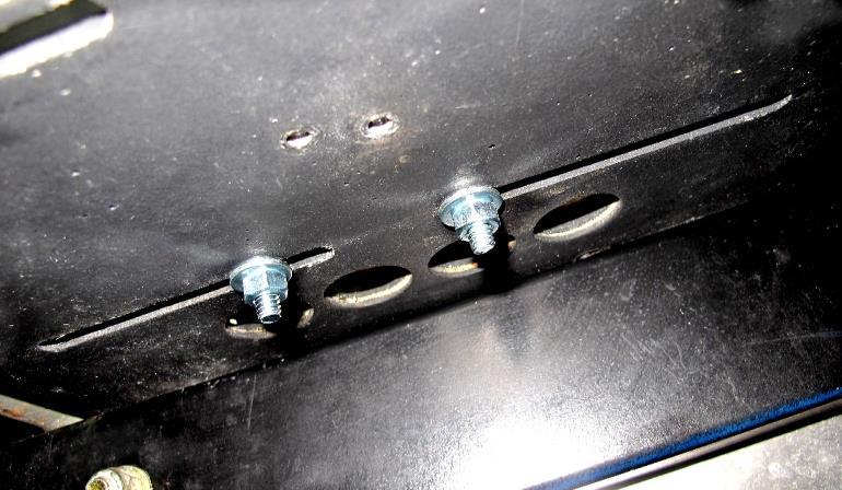 Use a #2 Flat-Head screwdriver to hold the bolts in