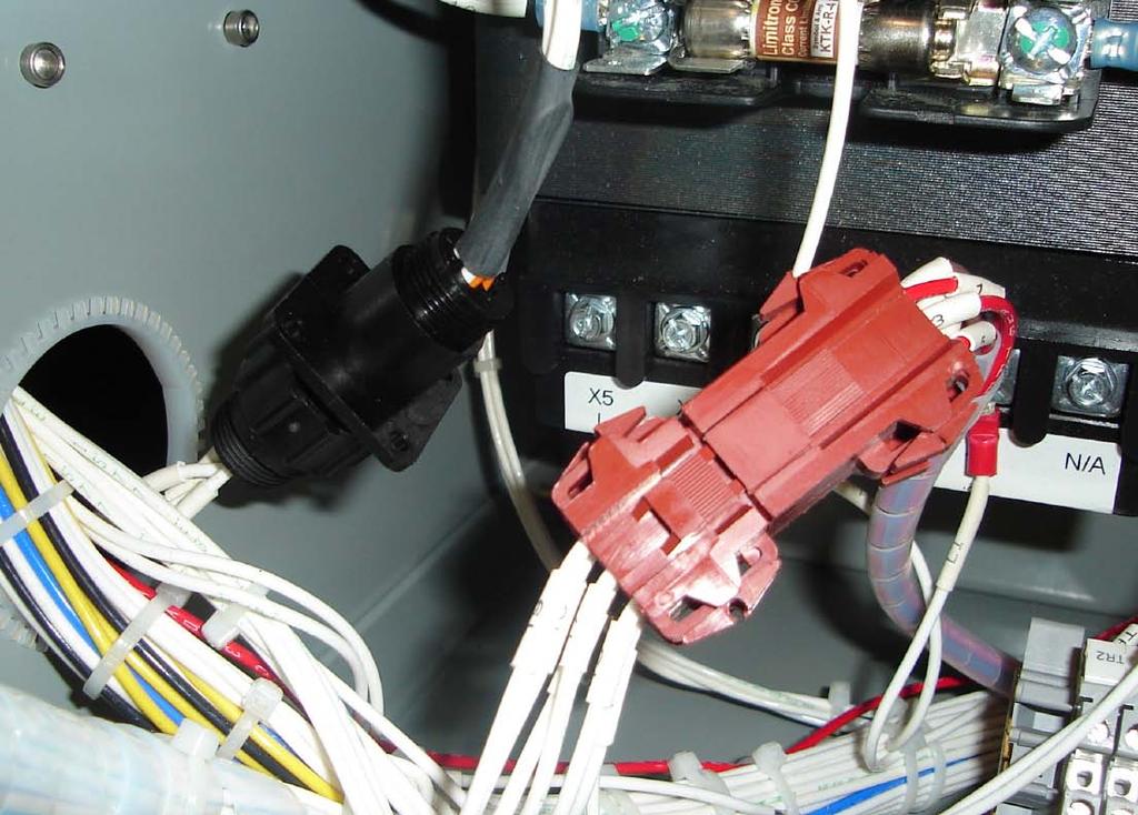 Attach the six point plug of the new secondary harness to the six point socket of the ARM CT module as shown in Figure 16.