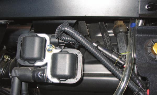 These connectors are located next to the ignition coils. FIG.