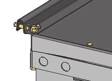 2. Install bolt (A) with spacer (B) and nut on each leg in the upper hole.